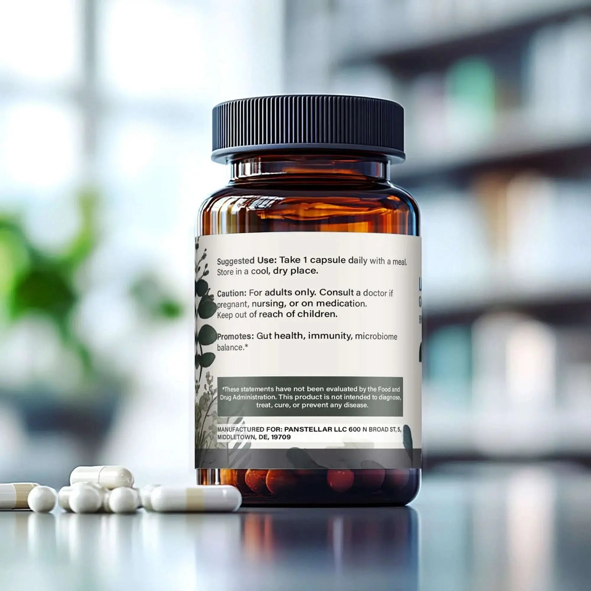 Amber supplement bottle labeled for gut health and immunity with white capsules nearby on a table.
